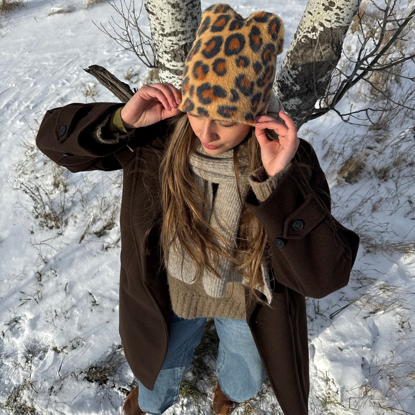 
                  
                    Close-up of  a cozy leopard beanie with a bold animal pattern
                  
                