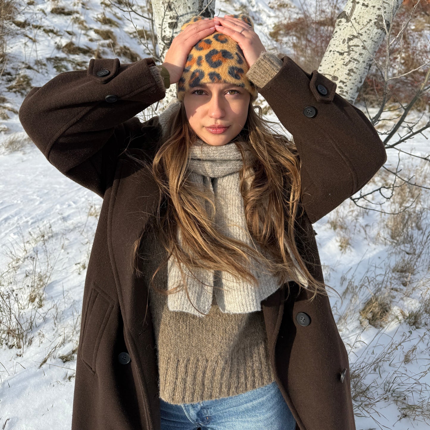 Leopard knit hat with a fuzzy mohair aesthetic in the snow