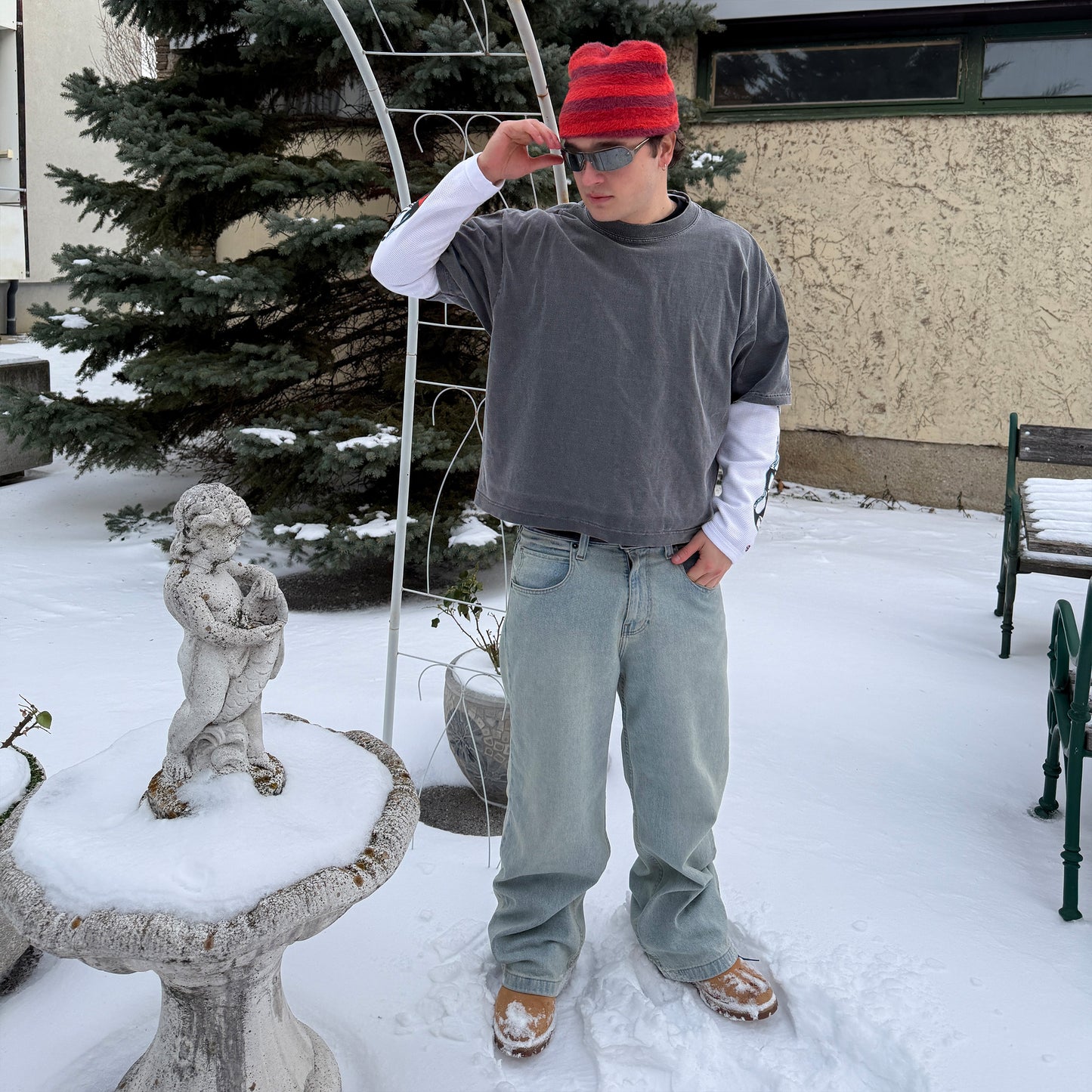
                  
                    BOXY FIT STRIPED FUZZY BEANIE STYLED WITH OVERSIZED STREETWEAR AND WRAPAROUND SUNGLASSES.
                  
                